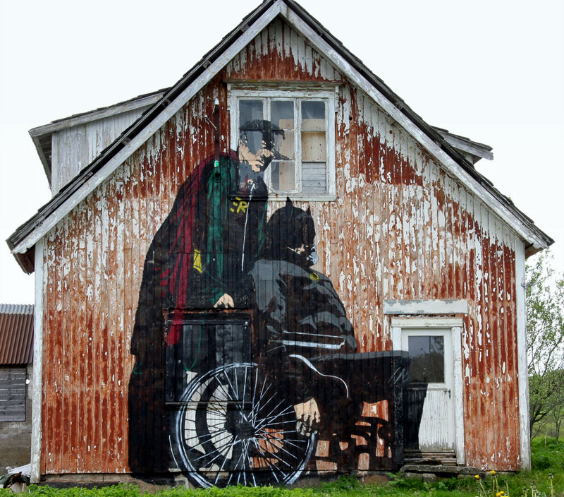 7. Elderly Batman and Robin graffiti on the barn wall