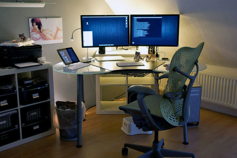 19. Pretty average glass table have enough room for the two-monitor setup and an iPad with keyboard