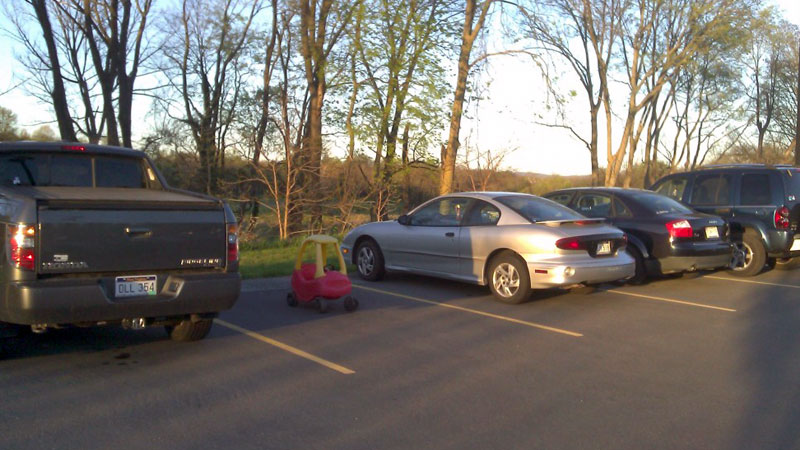 1. A toy car left in the parking lot