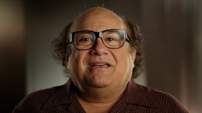 Danny DeVito was working as a barber.